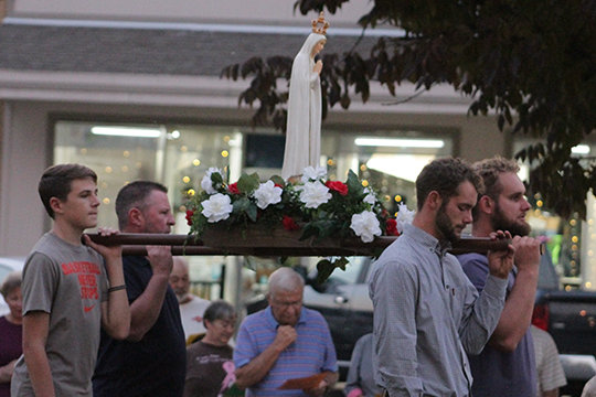 About 140 people take part in the third monthly Rosary procession to the Pike County Courthouse in Bowling Green the evening of Oct. 7, the Memorial of Our Lady of the Rosary.